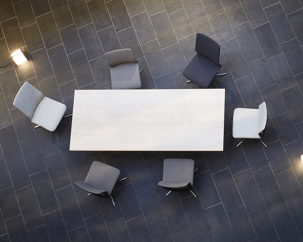 An overhead view of a conference table and MN1 chairs