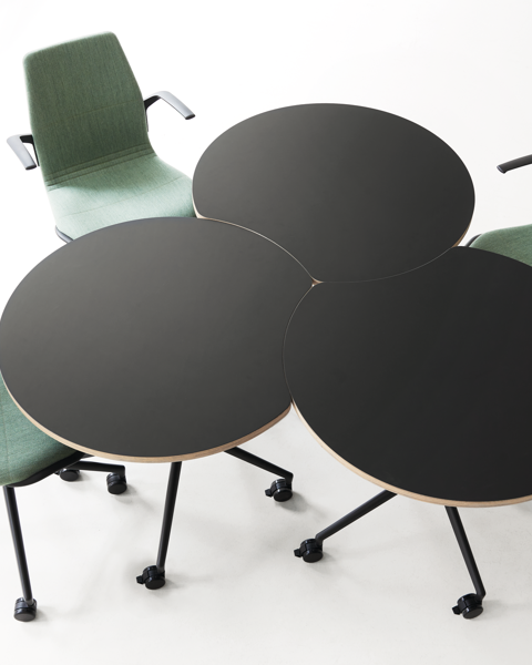 An installation image of three AS400 round-concave tables and three AS100 chairs 