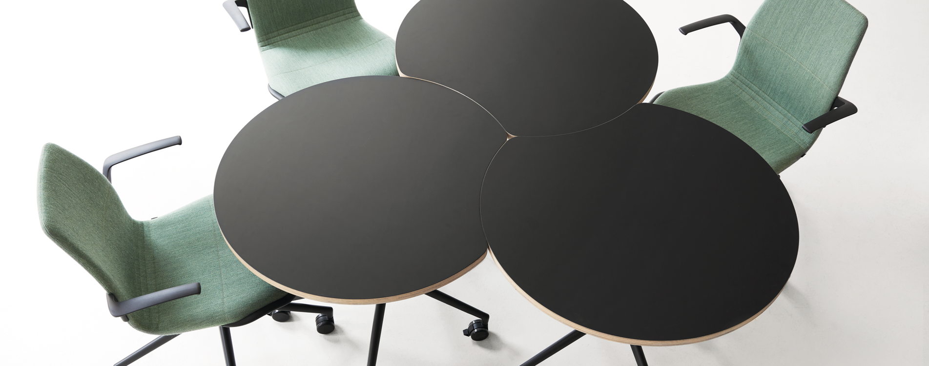 An installation image of three AS400 round-concave tables and three AS100 chairs 