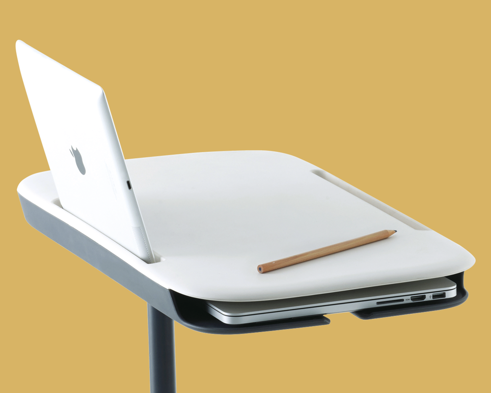 A detailed image of a white writing tablet on a yellow background with a tablet and pencil on the writing tablet