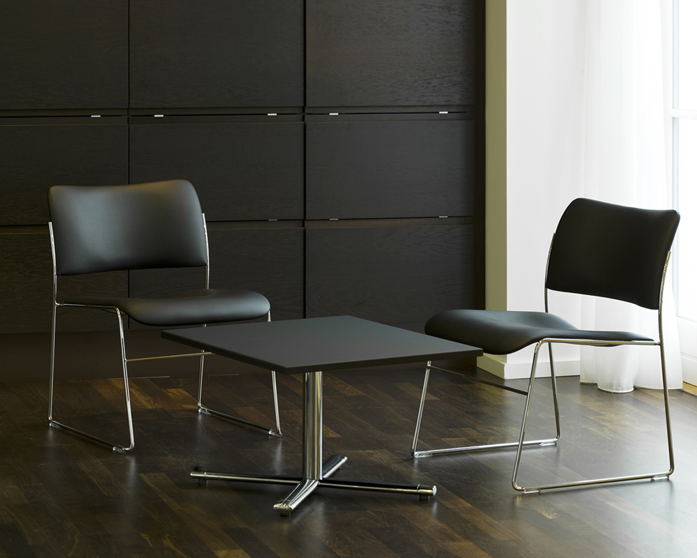 Black Tempest lounge table and two black 40/4 lounge chairs 