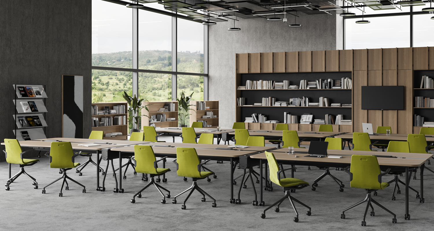 An installation image features Folding Surfaces tables in an office library setting and green AS100 chairs