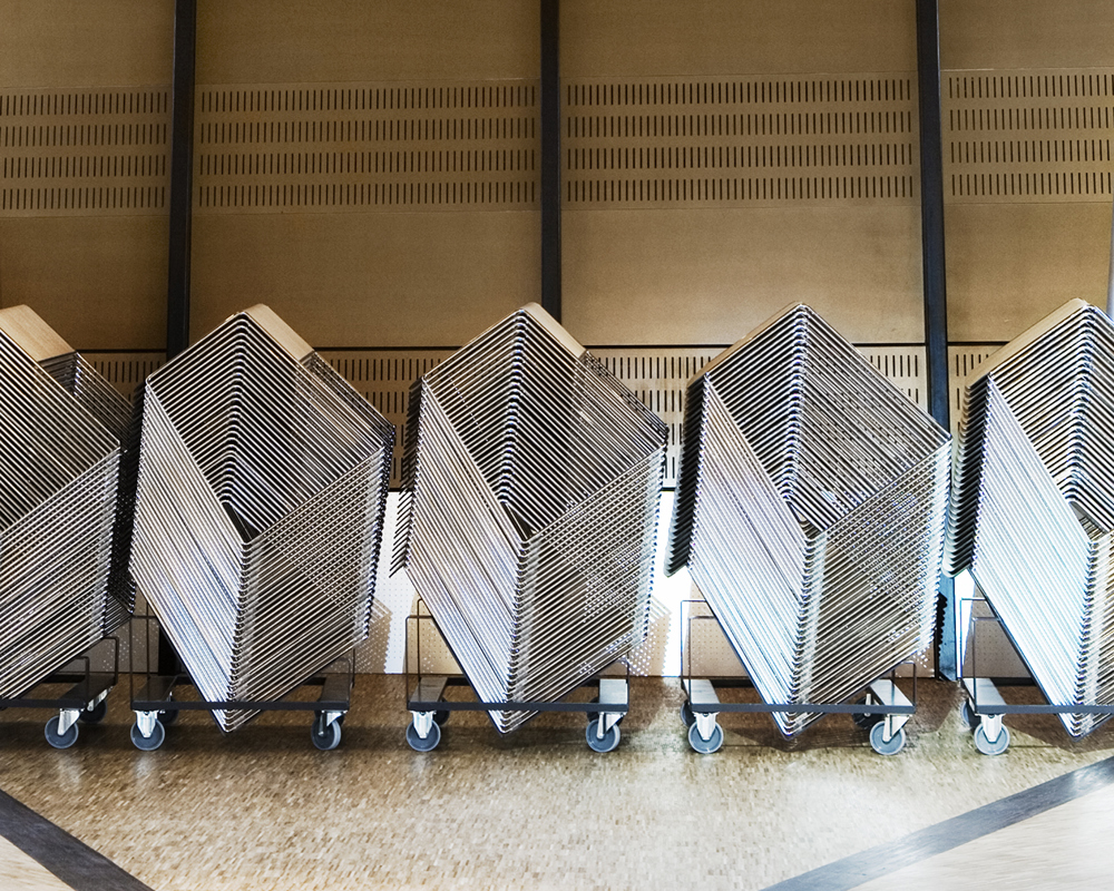 A row of stacked Tutor tables on dollies in ESSEC Business School