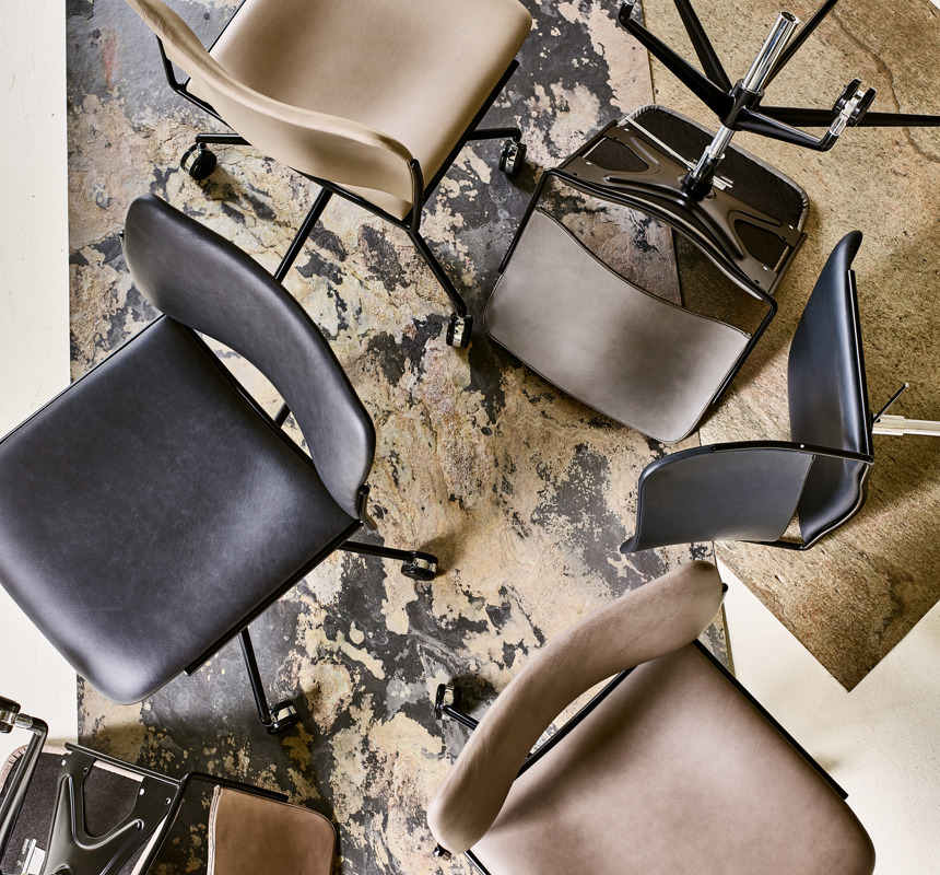 An installation image featuring various leather-upholstered 40/4 chairs