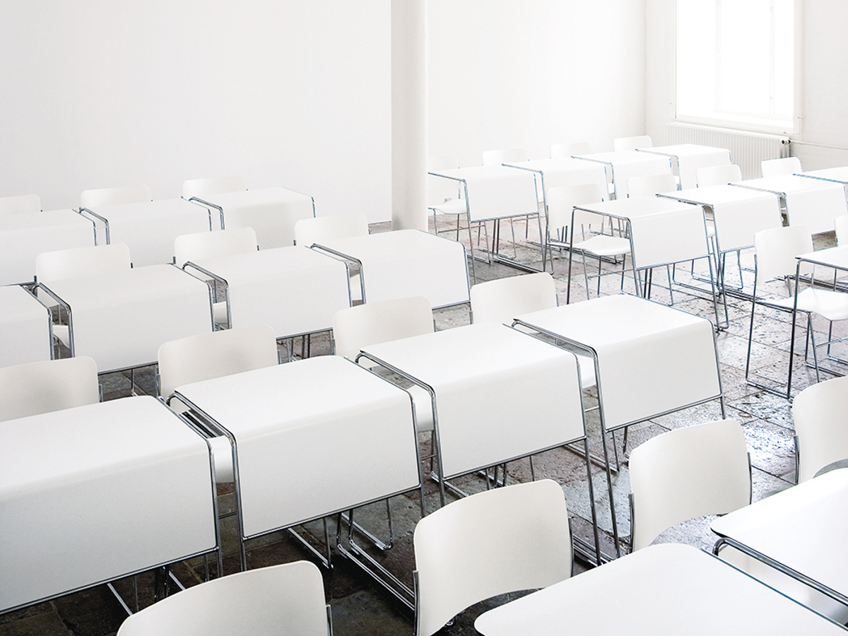 An installation image with white Tutor tables and white 40/4 chairs