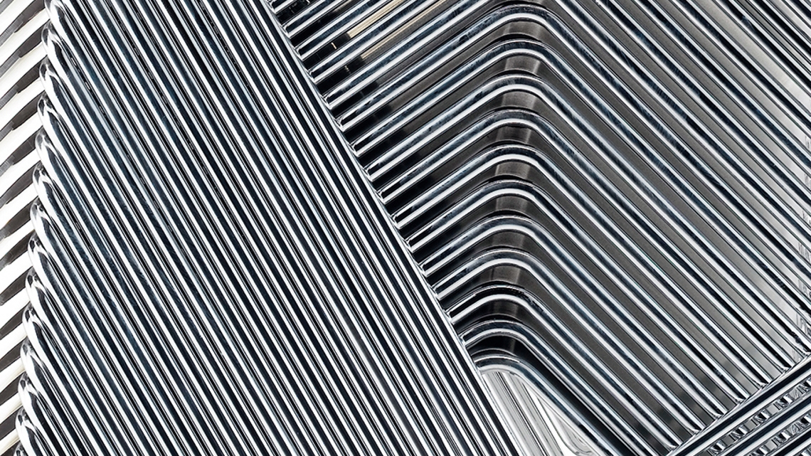 A closeup image of a metal structure of stacked Tutor frames 