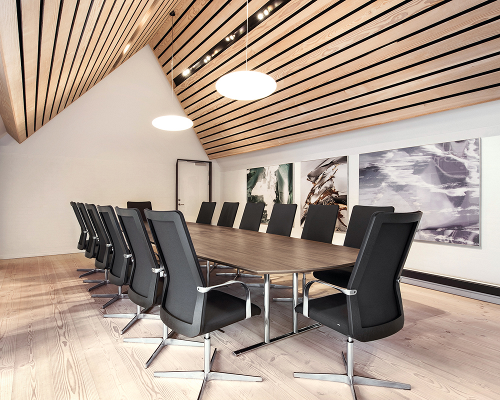 A Tempst table and MN1 chairs in a conference room with a wooden ceiling