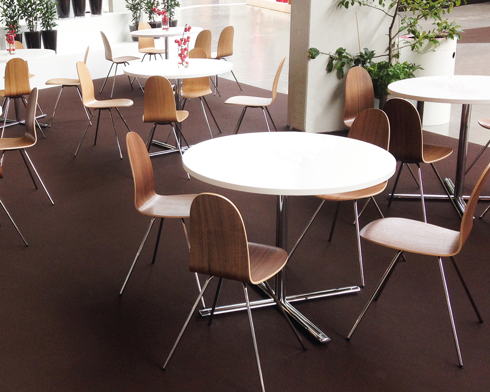 Tongue chairs around white Tempest café tables